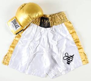 lot 35 image: Cassius Clay 1960 Olympics Gold Trunks & Gold Glove Set