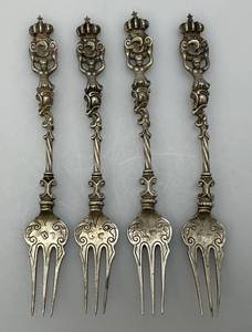 lot 148 image: Antique 800 Silver  Georgian Heraldic Forks Set Of Four 110.89 Grams