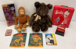 lot 240 image: Misc. Vintage Toys Including 1962 Barbie Case, MC Hammer Action Figure, Lion King And More (Some New Old Stock)