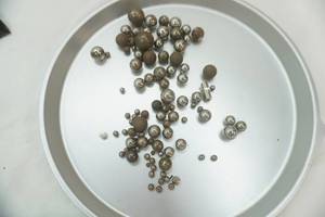 lot 224 image: Round Stones and Metal Balls