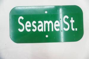 lot 255 image: 12x6 Metal Sign Sesame St.