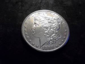 lot 10 image: 1886 S Morgan Silver Dollar