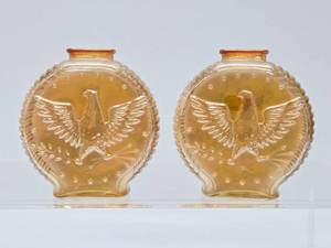 lot 122 image: 2 Vintage Carnival Glass Eagle Bottles