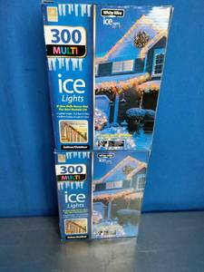 lot 28 image: 2 Boxes, Holiday branded 300-count multi-color incandescent icicle lights with white wire.