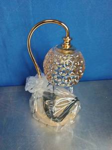 lot 34 image: �Pearl Candle Warmer Lamp with a gold-tone arch and a glass shade with a dimpled or bubble texture.
