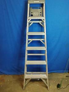 lot 56 image: Husky 6-foot aluminum step ladder.