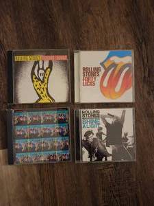 lot 113 image: 4 Rolling Stones music albums and concert films on CD or DVD format