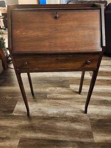 lot 137 image: Antique slant-top desk, also known as a secretary desk or bureau.