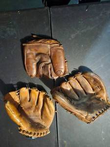 lot 151 image: 3  Vintage Nokona Fieldrite baseball gloves, likely from the mid-20th century.