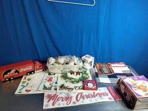 lot 66 image: Collection of Coca-Cola and general Christmas-themed holiday decorations and collectibles.