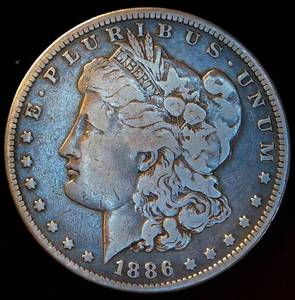 lot 41 image: Fine 1886 S Morgan Silver Dollar, cleaned & retoned