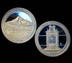 lot 50 image: (2) Proof 90% Silver ATB Quarters - 2010 Arkansas & Oregon