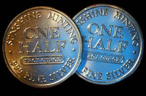 lot 67 image: (2) 12 oz 999 Sunshine Minting Silver Rounds