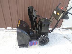 lot 102 image: Poulan Pro 249 snow blower with electric start. Used condition. Tested & works. As shown.