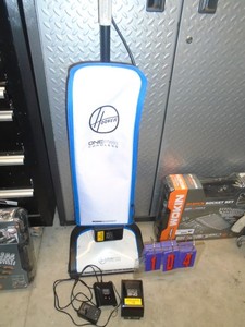 lot 104 image: Hoover One power cordless vacuum with 2 good batteries & charger. Looks new but wont power up. As shown.