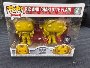 lot 227 image: Funko Pop WWE Ric and Charlotte Flair (Gold) (2-Pack) 2019 WWE Exclusive