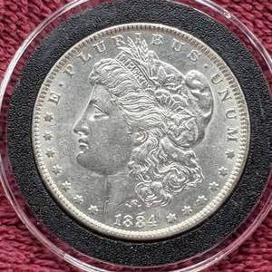 lot 23 image: 1884 Morgan Silver Dollar in Airtite, Higher Grade