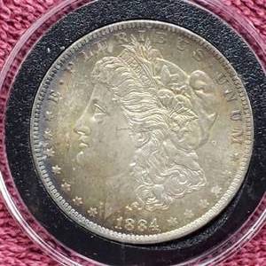 lot 27 image: 1884-O Morgan Silver Dollar in Airtite, High Grade, Beautiful Natural Toning