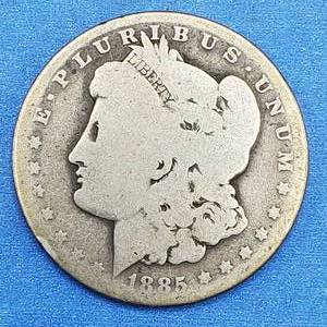 lot 72 image: 1885-O Morgan Silver Dollar. If this one could talk