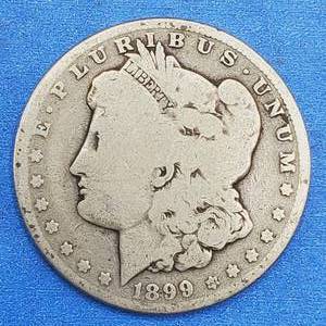 lot 76 image: 1899-O Morgan Silver Dollar