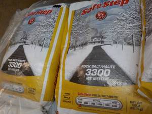 lot 135 image: 2 bags Safe Step 50 lbs. each Rock ...
