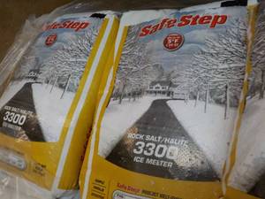 lot 137 image: 2 bags Safe Step 50 lbs. each Rock ...