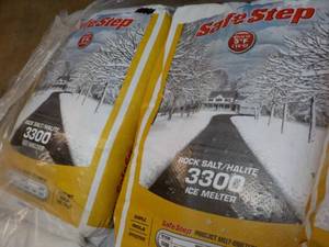 lot 139 image: 2 bags Safe Step 50 lbs. each Rock ...
