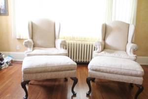 lot 13 image: Pair of Upholstered Wingback Chairs with Matching Ottomans