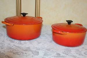 lot 71 image: Set of 2 Vintage Orange Enamel Cast Iron Dutch Ovens with Lids