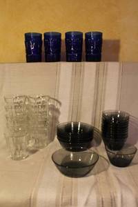 lot 109 image: Vintage Glassware Set with Blue Tumblers, Clear Glasses, and Dark Bowls