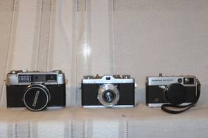 lot 157 image: Lot of 3 Vintage 35mm Film Cameras Yashica Lynx 1000 Leidolf Wetzlar Lordox Olympus 35 EC 2
