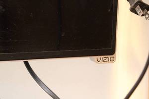 lot 171 image: Vizio Flat Screen TV with Xfinity Box and Dual-Sided Remote