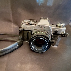lot A-333 image: Canon AE-1 35mm Film Camera with 50mm f1.8 FD Lens