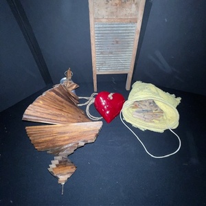 lot 304 image: Vintage Washboard, Bag of Clothespins, Wooden Whirligig, Heart Wall Decor, and Mesh Sweater Dryer Set