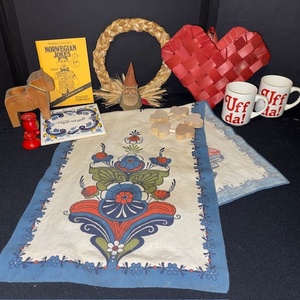 lot 309 image: Scandinavian Decor Collection with Towels, Uff Da Mugs, Dala Horse, and Folk Art Accents