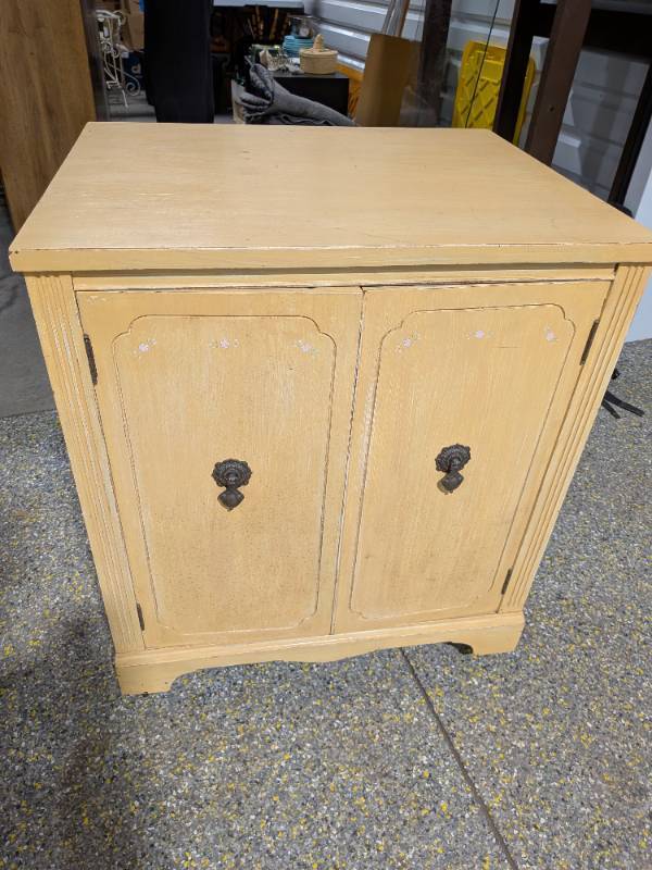 lot 15 image: Antique  Vintage Wheeled 2-Door Washstand Cabinet Yellow Paint Finish