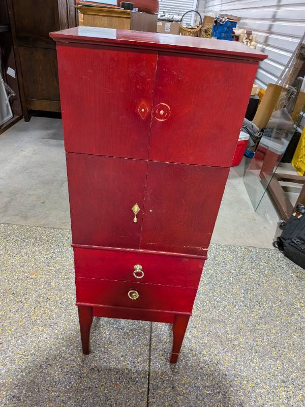lot 16 image: Tall Red Wood Jewelry Cabinet by Lori Greiner 4-Section Storage