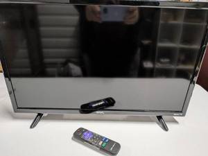 lot 58 image: Onn. 24-Inch LED Roku Smart TV Model 100012590 with Remote