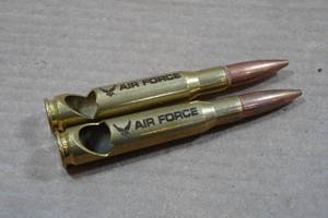 lot 166 image: US Air Force 50 Caliber Bullet Bottle Openers