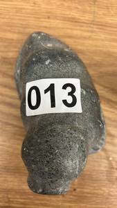 lot 13 image: Pair of Inuit Carved Stone Figures - Walrus and Hunter