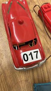 lot 17 image: Vintage Red Tin Toy Car with Wired Remote and Train Car
