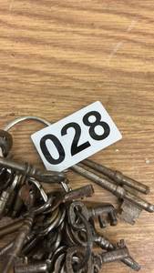 lot 28 image: Lot of Antique Skeleton Keys with Ornate Brass Needle Case