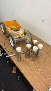 lot 64 image: Rust-Oleum Athletic Field Striping Machine with 6 Cans of Striping Paint