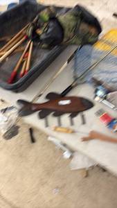 lot 78 image: Ice Fishing Lot with Manual Auger, Gear, Wooden Fish Hook Rack, Net, and Fillet Knife