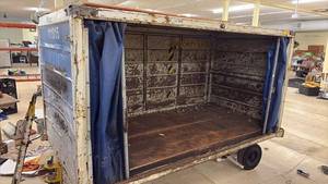 lot 111 image: Used Airline Cargo Container with Team USA Graphics and Rolling Base