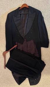 lot 173H image: LL - Donna Karan New York Couture Black Tailcoat and Pleated Pants Set 42R35W