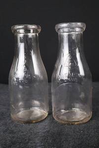 lot 376 image: Milk Bottles - One Pint Liquid Pair