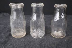 lot 388 image: Coca-Cola Glass Bottles - Embossed Script Made in England