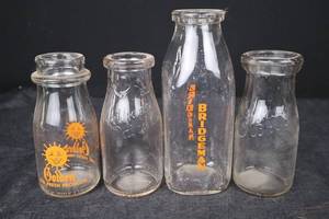lot 389 image: Glass Bottles - Golden Sun Logo & Bridgeman Branding & Embossed Script