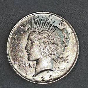 lot 55 image: 1923 Peace Dollar $1, AU Nice with Tone Mark